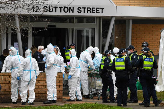 PUBLIC HOUSING COVID-19 CLUSTER MELBOURNE, Firefighters dressed in personal protective equipment prepare to distribute food throughout a public housing tower in North Melbourne, Tuesday, July 7, 2020. Nine towers in Flemington and North Melbourne were locked down on Saturday in an effort to slow the spread of coronavirus, with 3000 residents unable to leave their apartments for any reason for at least five days. ( NO ARCHIVING, EDITORIAL USE ONLY, NO USE IN BOOKS WITHOUT CONSENT MELBOURNE VIC AUSTRALIA  Copyright: xJAMESxROSSx 20200707001478524592