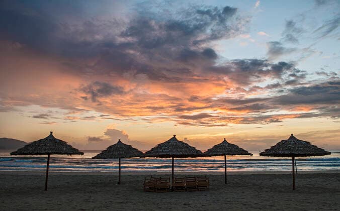 Parasol s on the empty beach in Da Nang Da Nang, Da Nang, Vietnam CR_THHE200703A-442595-01