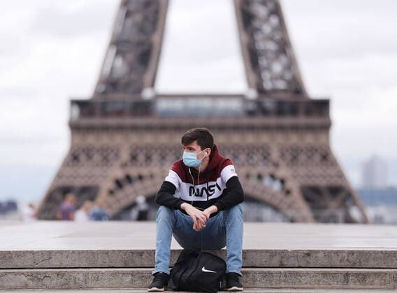 (200711) -- PARIS, July 11, 2020 -- A man wearing a face mask rests at the Trocadero Palace near the Eiffel Tower in Paris, France, July 10, 2020. With 25 new deaths recorded in the last 24 hours, coronavirus-related fatalities in France rose to 30,004, while the number of patients hospitalized or admitted to intensive care units continued to fall, official data showed on Friday. ) FRANCE-COVID-19-CASES GaoxJing 