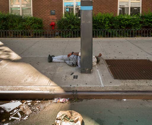 Homeless on the street in New York Individual sleeps on the sidewalk in Chelsea in New York on Sunday, July 12, 2020. (  RichardxB.xLevine
