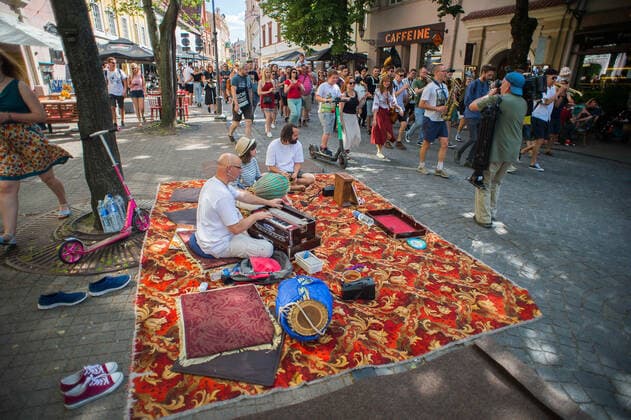 (200718) -- VILNIUS, July 18, 2020 (Xinhua) -- People perform during the Street Music Day event in Vilnius, Lithuania, on July 18, 2020. Professional and amateur musicians performed in the streets and parks in the old town of Vilnius to celebrate Street Music Day on Saturday. (Photo by Alfredas Pliadis Xinhua) LITHUANIA-VILNIUS-STREET MUSIC DAY 