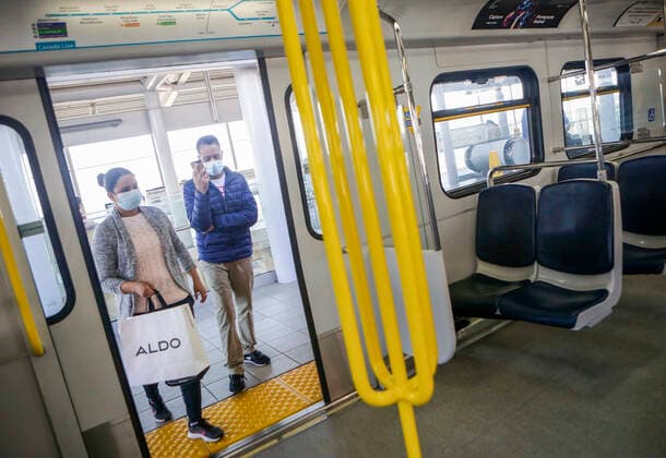 (200718) -- VANCOUVER, July 18, 2020 -- Passengers wearing face masks get on a SkyTrain in Vancouver, British Columbia, Canada, on July 18, 2020. As new COVID-19 cases in British Columbia continued to tick upwards, health officials urged those who can to wear a mask on transit and in other confined spaces, such as grocery stores. (Photo by Xinhua) CANADA-VANCOUVER-COVID-19-FACE MASKS LiangxSen 