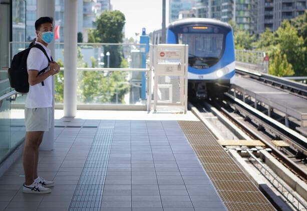 (200718) -- VANCOUVER, July 18, 2020 -- A passenger wearing a face mask waits to ride a SkyTrain in Vancouver, British Columbia, Canada, on July 18, 2020. As new COVID-19 cases in British Columbia continued to tick upwards, health officials urged those who can to wear a mask on transit and in other confined spaces, such as grocery stores. (Photo by Xinhua) CANADA-VANCOUVER-COVID-19-FACE MASKS LiangxSen 