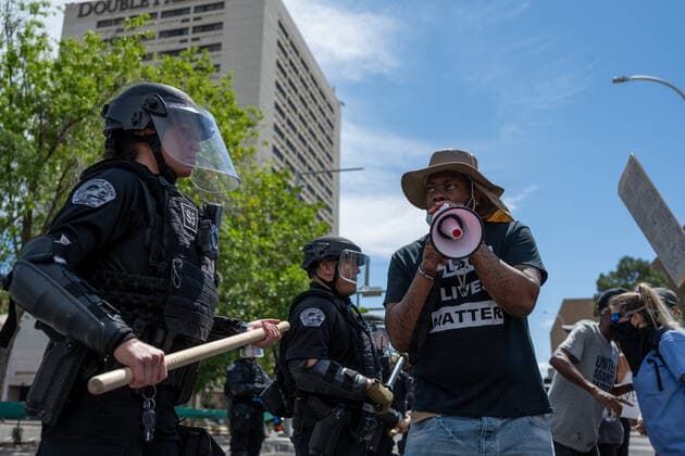 July 19, 2020, Albuquerque, New Mexico, USA: July 19, 2020.Counter protesters at the We Can t Breathe protest against the public health order to wear facemasks form a buffer between Albuquerque police officers in riot gear and other counter protesters in Civic Plaza, Sunday afternoon. Albuquerque USA - ZUMAab1_ 20200719_zaf_ab1_003 Copyright: xAnthonyxJacksonx