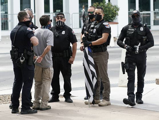 July 19, 2020, Albuquerque, NEW MEXICO, USA: 071920 ..A man is arrested by APD officers after showing up armed with a handgun at a rally at Civic Plaza in support of Black Lives Matter .Photographed on Sunday July 19, 2020.Adolphe Pierre-LouisJournal. Albuquerque USA - ZUMAab1_ 20200719_zaf_ab1_011 Copyright: xAlbuquerquexJournalx
