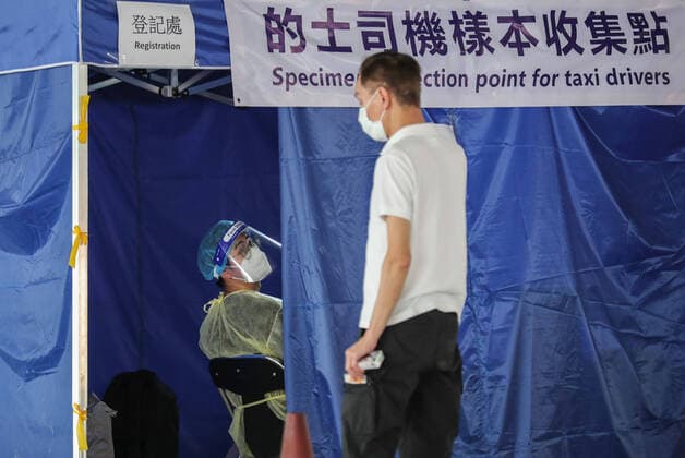 July 20, 2020, Hong Kong, China: A taxi driver registers at a makeshift testing station in a carpark with a health workers for coronavirus (COVID-19) test ..The deadly coronavirus is spreading out of control in Hong Kong with a record 100 new cases confirmed, the finance hub s leader said she has tightened social distancing measures to tackle the sudden surge in infections. Hong Kong China - ZUMAs197 20200720_zaa_s197_027 Copyright: xMayxJamesx