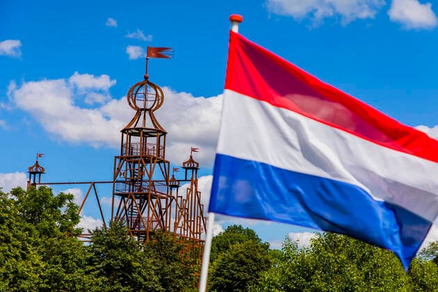 Bears, The Netherlands July 12, 2020 - Dutch flag waves at the Steel replica of the Uniastate designed by artist Bep Mulder. The monument, located in the northern province of Friesland forms the skeletal mirage of a lost 16th century stone building where a prominent family, the Unias, once lived in the modest village of Bears. CONSTRUCTION, PROJET ARTISTIQUE, MIRAGE, METAL, INSOLITE, ART MODERNE, PAYS BAS, ILLUSTRATION, BENELUX, BIZARRE, CURIEUX, CURIOSITE, CONSTRUIRE, PAYSAGE, NATURE, CAMAPGNE, REPLIQUE D UN CHATEAU, MOYEN AGE, MEMOIRE, PASSE, SOUVENIRS, MONUMENT, PROVINCE DE LA FRISE, CREATIF, CREATIVITE, LAND ART, ART PAYSAGER, CULTURE NEERLANDAISE, LIEU ISOLE, HISTOIRE, VIDE, ABSENCE, DESIGN, INSPIRATION, IMAGINAIRE, IMAGINATION, REV  Copyright: xVincentxIsorex