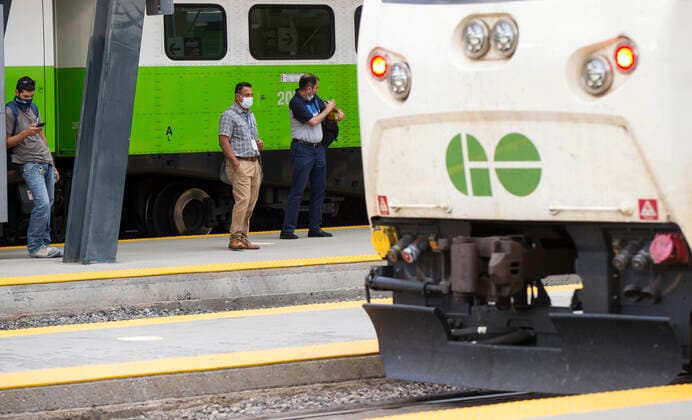 (200721) -- TORONTO, July 21, 2020 -- Passengers wearing face masks wait for a Go train on the platform at Union Station in Toronto, Canada, on July 21, 2020. Starting Tuesday, Go Transit customers are required to wear masks or face coverings. (Photo by Xinhua) CANADA-TORONTO-COVID-19-MEASURES-GO TRANSIT ZouxZheng 