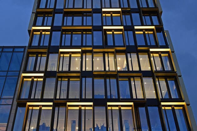 View of deserted, empty offices, where the light is still on Modern offices, design offices in Arnulfpark in Munich