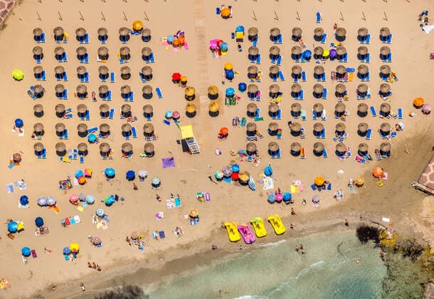 Aerial view, beach life in the bay of Peguera, beach Platja Gran de TorÃ , distance rule Corona, Camp De Mar Es , Europe, Baleares, Spain ATTENTIONxMINDESTHONORARX60xEURO
