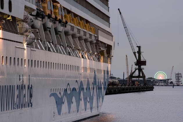 The ship Aidamar is firmly moored at the pier in the Rostock seaport The compa Copyright: FrankxHormannx xnordlicht