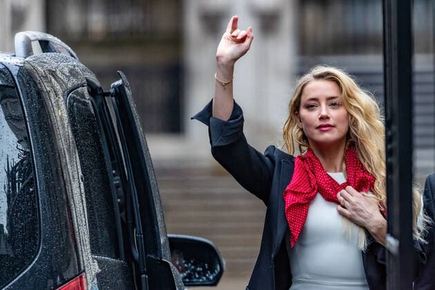 US actress Amber Heard gestures and waves as she arrives at the High Court in London on Monday, July 27, 2020. She will attend a hearing in Johnny Depp s libel case against the publishers of The Sun and its executive editor, Dan Wootton when her defence is expected to wrap up their case. 57-year-old Depp is suing the tabloid s publisher News Group Newspapers (NGN) over an article which called him a wife-beater and referred to overwhelming evidence he attacked Ms Heard, 34, during their relationship, which he strenuously denies. (VXP Photo Vudi Xhymshiti)  VXP