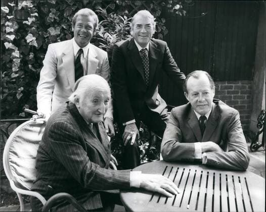 Jul. 3, 1980 - London, England, United Kingdom - GREGORY PECK, rear right, and ROGER MOORE, rear left, met the real-life personalities of their characters in their new film Sea Wolves . The stars portray the story of COLIN MCKENZIE (nearest camera) and Major-General LEWIS PUGH in their new adventure film and met at a reception held in London today. The film, dedicated to Lord Mounthatten, has its Royal Premiere tonight. London United Kingdom - ZUMAk09_ 19800703_jes_k09_893 Copyright: xKEYSTONExPicturesx