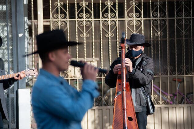 Leiver Castillo the singer and two of his friends Johnatan Garcia on the Cuatro Guitar and Oscar Serpa the Harpist, formed a traditional Llanera genere music group to perfom in the streets of Bogota to survive the economic recession that the novel Coronavius has put on music performers and shows across the country. In Bogota, Colombia, on July 28 2020. Bogota Cundinamarca Colombia Copyright: xSebastianxBarrosx BarrosSebastian_musicallanera_20200728_020