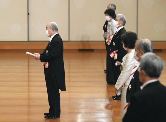 Imperial conferment of decorations Former Asahi Breweries Ltd. CEO Hitoshi Ogita (L) delivers a speech in front of Japanese Emperor Naruhito during a ceremony for conferment of grand cordons at the Imperial Palace in Tokyo on July 31, 2020. Attendees wear face masks amid the novel coronavirus pandemic. (Pool photo) 