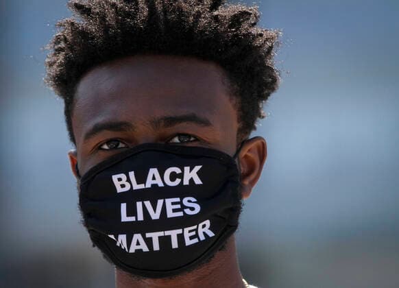 (200801) -- VANCOUVER, Aug. 1, 2020 -- A protestor takes part in the Emancipation Day march in Vancouver, British Columbia, Canada, August 1, 2020. In conjunction with the Black Lives Matter protest, thousands of people took part in a march to commemorate the Emancipation Day in Canada, which is marked on August 1. (Photo by Xinhua) CANADA-VANCOUVER-EMANCIPATION DAY MARCH LiangxSen 