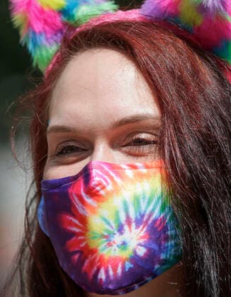 (200802) -- VANCOUVER, Aug. 2, 2020 -- A participant wearing a mask takes part in the Clean Sober and Proud Walk in Vancouver, British Columbia, Canada, on Aug. 2, 2020. People took part in the parade to raise awareness and support people in recovering from drug and alcohol addiction. (Photo by Xinhua) CANADA-VANCOUVER-CLEAN SOBER AND PROUD WALK LiangxSen 