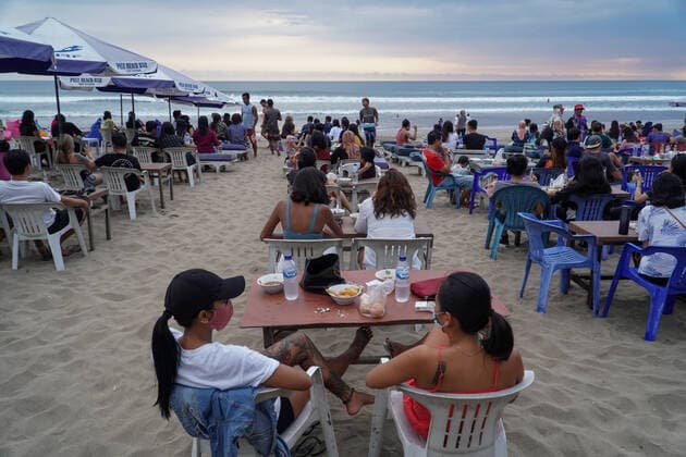 August 10, 2020, Badung, Bali, Indonesia: Tourists sits grouping on the beach chair. People enjoy their holiday at Legian Beach amid Covid-19 coronavirus outbreak as Bali reopened for Indonesian domestic tourism per July 31, 2020. Local authority schedule to open the international tourism on September 11, 2020. Badung Indonesia - ZUMAb245 20200810_zip_b245_017 Copyright: xDickyxBisinglasix