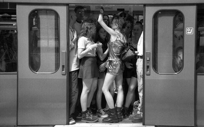 Technofans stand crowded in a full S train car on their way to the Lovapare 1997 Love Parade 1997 in Berlin