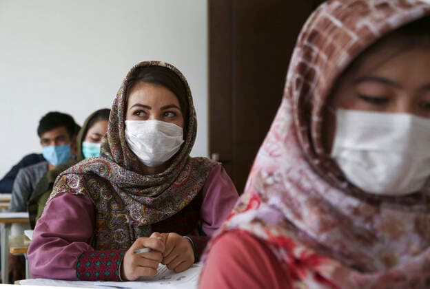 (200812) -- KABUL, Aug. 12, 2020 (Xinhua) -- Students wearing face masks attend a lecture at the Kabul University in Kabul, capital of Afghanistan, Aug. 12, 2020. The Kabul University has reopened recently following its closure due to the COVID-19 outbreak. (Photo by Rahmatullah Alizadah Xinhua) AFGHANISTAN-KABUL-COVID-19-UNIVERSITY-REOPENING 