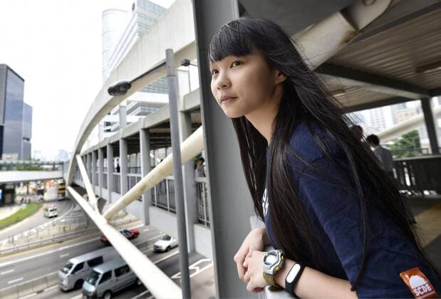 Hong Kong pro-democracy activist Agnes Chow Photo taken in September 2015 shows Hong Kong pro-democracy activist Agnes Chow overlooking a thoroughfare in the Admiralty district on Hong Kong Island, where a series of street protests were staged during the 2014 Umbrella Movement that called for a fully democratic government in the territory. 