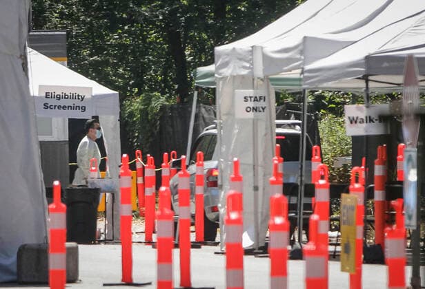 (200814) -- VANCOUVER, Aug. 14, 2020 -- A healthcare worker is seen at a COVID-19 testing facility in Vancouver, British Columbia, Canada, on Aug. 14, 2020. British Columbia s COVID-19 curve is now climbing at a higher rate than the initial outbreak in March, and new provincial modelling shows B.C. could see a second wave bigger than the first by September. (Photo by Xinhua) CANADA-VANCOUVER-COVID-19-TEST LiangxSen 