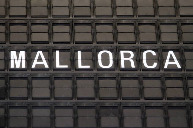 The destination Palma de Mallorca is displayed on the scoreboard at Frankfurt Airport The Germans favourite island has once again been declared a Covid 19 risk area, which means that all returnees are required to undergo a corona test, Hessen, Germany
