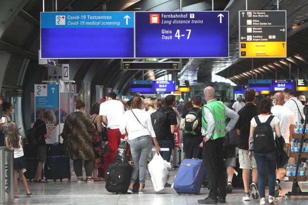 Record rush of people returning and entering the country n mostly from Spain and Balkan countries s to a Covid 19 test centre of Centogene at Frankfurt Airport to be tested on Corona at the end of their journey, Hesse, Germany