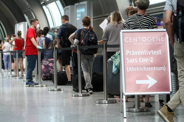 Record rush of people returning and entering the country n mostly from Spain and Balkan countries s to a Covid 19 test centre of Centogene at Frankfurt Airport to be tested on Corona at the end of their journey, Hesse, Germany