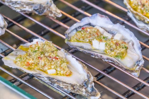 Chinese snack roasted oysters close-up  634041042441207871
