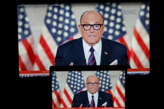 (200828) -- WASHINGTON, D.C., Aug. 28, 2020 -- Photo taken in Arlington, Virginia, the United States, Aug. 27, 2020 shows screens displaying former New York City mayor and Trump s personal attorney Rudy Giuliani speaking during the 2020 Republican National Convention from Washington, D.C. ) U.S.-REPUBLICAN NATIONAL CONVENTION LiuxJie 