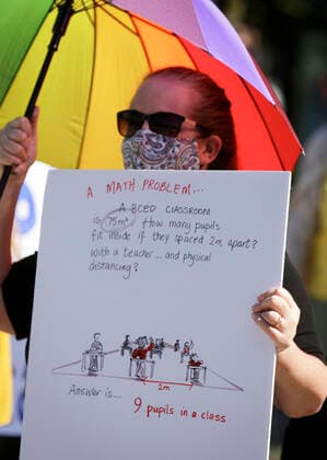 (200829) -- VANCOUVER, Aug. 29, 2020 -- A woman attends the Safe September rally in Vancouver, British Columbia, Canada, on Aug. 29, 2020. A group of teachers and parents rallied Saturday demanding the province of British Columbia rethink its back-to-school plans. (Photo by Xinhua) CANADA-VANCOUVER-COVID-19- SAFE SEPTEMBER RALLY LiangxSen 