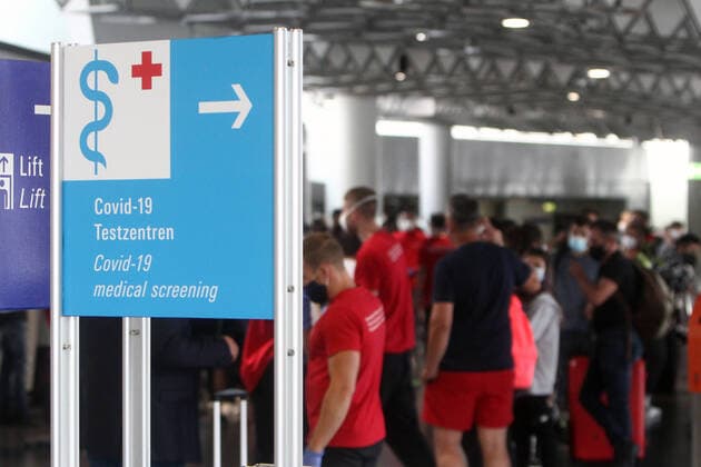 Returning travellers and those entering from risk areas register for a corona test at a Centogene Covid 19 test centre at Frankfurt Airport, Hesse, Germany
