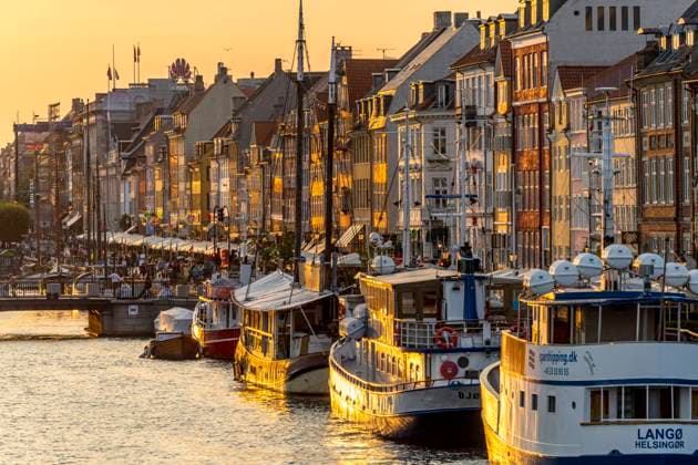 Nyhaven Colourful houses, restaurants and old ships along the canal and harbour Nyhavn, Copenhagen, Denmark, Europe Colourful facades, restaurants and old ships along the Nyhavn Canal and harbour, Copenhagen, Denmark, Europe