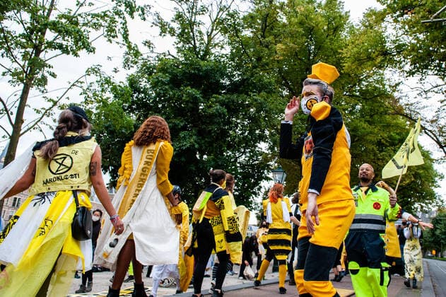 September 1, 2020, The Hague, South Holland, Netherlands: XR models dancing while parading with the new designs during the fashion show..An XR fashion show was carried out in front of the House of Representatives in The Hague. Models wore yellow, black, and white colourful second-hand outfits to symbolise the collectivity of bees, to show that thinking and working together can help us out of this crisis. The Hague Netherlands - ZUMAs197 20200901_zaa_s197_026 Copyright: xAnaxFernandezx