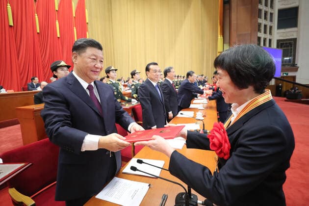 (200908) -- BEIJING, Sept. 8, 2020 -- Chinese President Xi Jinping, also general secretary of the Communist Party of China Central Committee and chairman of the Central Military Commission, presents awards to outstanding Party members during a meeting commending role models in the country s fight against the COVID-19 epidemic at the Great Hall of the People in Beijing, capital of China, Sept. 8, 2020. ) CHINA-BEIJING-COVID-19 FIGHT-ROLE MODELS-COMMENDATION MEETING (CN) JuxPeng 