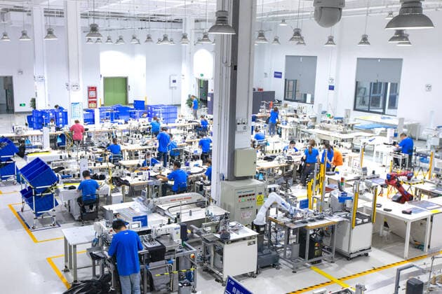HANGZHOU, CHINA - SEPTEMBER 15: Employees work at the Xunxi Digital Factory on September 15, 2020 in Hangzhou, Zhejiang Province of China. Alibaba Group unveils its new manufacturing model - the Xunxi Digital Factory on Wednesday.  Copyright: xVCGx CFP111299057532