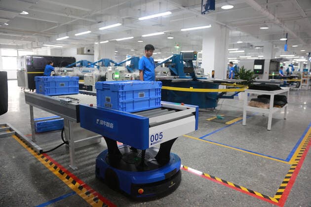HANGZHOU, CHINA - SEPTEMBER 16: Employees work at the Xunxi Digital Factory on September 16, 2020 in Hangzhou, Zhejiang Province of China. Alibaba Group unveils its new manufacturing model - the Xunxi Digital Factory on Wednesday.  Copyright: xVCGx CFP111299078766