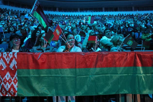 MINSK, BELARUS - SEPTEMBER 17, 2020: Members of the Belarusian Union of Women hold a Belarusian flag ahead of a concert featuring Russian singers at Minsk Arena. Natalia Fedosenko TASS  TS0E74AD