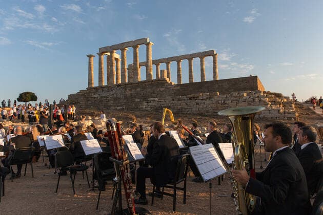 (200917) -- ATHENS, Sept. 17, 2020 -- Musicians perform a musical in front of the ruins of the Temple of Poseidon at cape Sounion, some 70 km southeast of Athens, Greece, on Sept. 17, 2020. On the occasion of the 70th anniversary of the establishment of the Greek National Tourism Organization (GNTO) and the 71st anniversary of the founding of the People s Republic of China and the Mid-Autumn festival, a musical entitled As long as there shall be Achaeans -- Variations on a Sunbeam was staged on Thursday in front of the ruins of the emblematic 2,500-year-old Temple of Poseidon, the god of the sea in Greek mythology. ) GREECE-CAPE SOUNION-MUSICAL-SINO-GREEK FRIENDSHIP MariosxLolos 