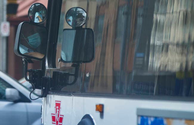 (200917) -- TORONTO, Sept. 17, 2020 -- A TTC bus driver wearing a face mask is seen from side mirrors of a bus in Toronto, Canada, on Sept. 17, 2020. Starting on Thursday, face coverings or masks are mandatory in all shared TTC (Toronto Transit Commission) spaces, both indoors and outdoors. This also applies to operators when they are behind the protective barrier or in the cab. (Photo by Xinhua) CANADA-TORONTO-COVID-19-MEASURES ZouxZheng 