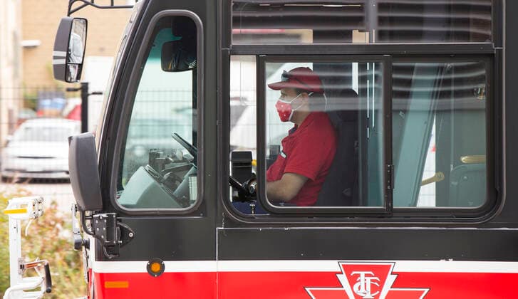 (200917) -- TORONTO, Sept. 17, 2020 -- A TTC bus driver wearing a face mask is seen on a bus in Toronto, Canada, on Sept. 17, 2020. Starting on Thursday, face coverings or masks are mandatory in all shared TTC (Toronto Transit Commission) spaces, both indoors and outdoors. This also applies to operators when they are behind the protective barrier or in the cab. (Photo by Xinhua) CANADA-TORONTO-COVID-19-MEASURES ZouxZheng 