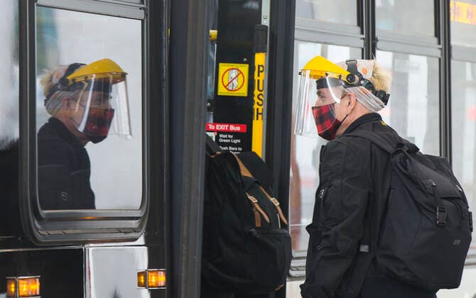 (200917) -- TORONTO, Sept. 17, 2020 -- A man wearing a mask and a face shield gets on a bus in Toronto, Canada, on Sept. 17, 2020. The number of COVID-19 cases in Canada rose to 140,539 on Thursday, with 9,199 deaths, according to CTV. (Photo by Xinhua) CANADA-TORONTO-COVID-19-CASES ZouxZheng 