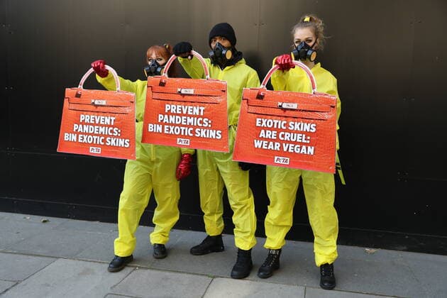 . 17 09 2020. London, United Kingdom. PETA supporters dressed in hazmat suits stage a protest against the use of exotic animal skins at London Fashion Week.  xStephenxLockx xi-Imagesx IIM-21623-0001