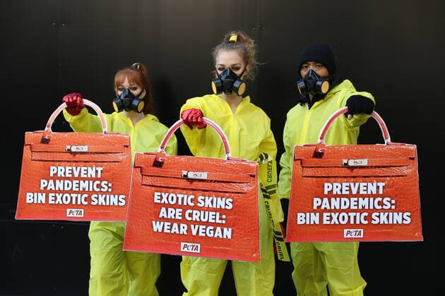 . 17 09 2020. London, United Kingdom. PETA supporters dressed in hazmat suits stage a protest against the use of exotic animal skins at London Fashion Week.  xStephenxLockx xi-Imagesx IIM-21623-0007