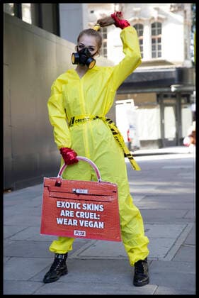. 17 09 2020. London, United Kingdom. A PETA supporter dressed in a hazmat suit, part of a protest against the use of exotic animal skins at London Fashion Week.  xStephenxLockx xi-Imagesx IIM-21623-0025