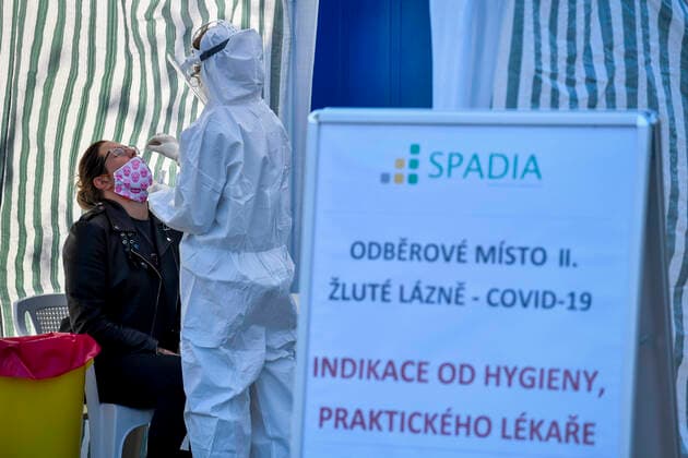 The Czech Republic confirmed 985 COVID-19 cases on Sunday, dropping under 1,000 for first time after a week, but fewer people are usually tested during weekends. People wait at the sampling point for testing on COVID-19 in Prague, Czech Republic, September 21, 2020. (CTKxPhoto VitxSimanek) CTKPhotoP202009210296101 VIS 003