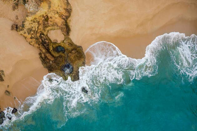 Portugal, Algarve, Lagoa, Drone view of sandy beach at Praia de Albandeira RUEF03076