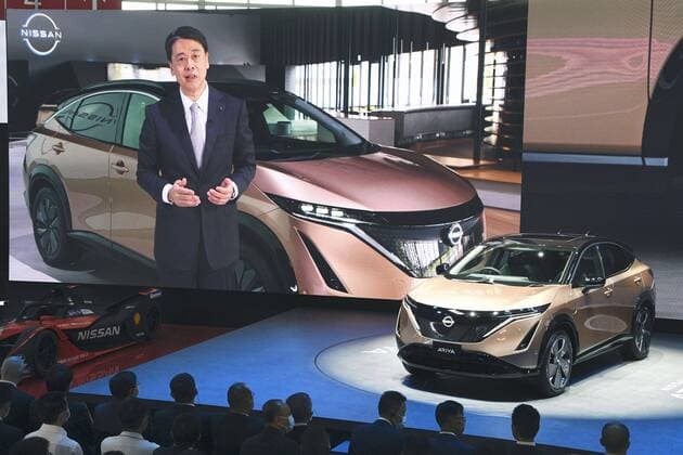 Beijing Motor Show Photo taken on Sept. 26, 2020, shows Nissan Motor Co. s all-electric Ariya sport utility vehicle unveiled as the 16th Beijing Motor Show kicks off in the Chinese capital five months behind schedule due to the coronavirus pandemic. Nissan President and CEO Makoto Uchida, shown on a large screen, explained the vehicle online. 