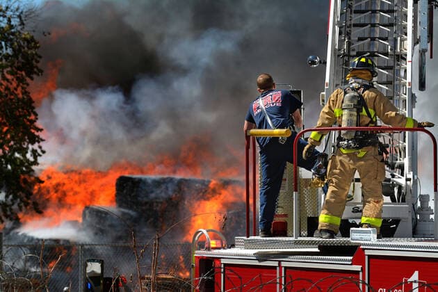 September 29, 2020, Albuquerque, NM, USA: AFR firefighters look on as the fire rages at the Friedman Recycling plant. Tuesday, Sept. 29, 2020. Albuquerque USA - ZUMAab1_ 20200929_zaf_ab1_001 Copyright: xJimxThompsonx